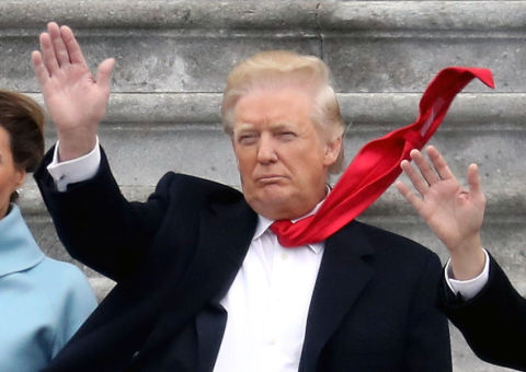 Why does Trump insist on wearing his tie long